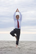 Businessman doing yoga