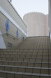 Photo: dubai uae a businessman ascends a staircase leading to deira’s souqs old fortress architecture. dubai uae a businessman ascends a staircase leading to deira’s souqs old fortress architecture.