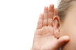 Girl listening with her hand on an ear