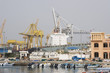Photo: khor fakkan uae large cargo ships docked to load and unload goods at khor fakkport khor fakkan uae large cargo ships docked to load and unload goods at khor fakkport
