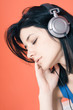 Woman listening music on headphones