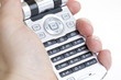 Hand holding a mobile phone / cellular phone / handy Hand holding a mobile phone / cellular phone / handy