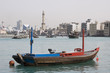 Photo: dubai uae empty abra anchored on dubai creek with minaret of grand mosque in distance dubai uae empty abra anchored on dubai creek with minaret of grand mosque in distance