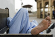 Photo: dubai uae man taking rest on park bench along boardwalk in bur dubai dubai uae man taking rest on park bench along boardwalk in bur dubai