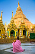 Young Lady monk praying at the Shwedagon Paya, Yangoon, Myanmar. Young Lady monk praying at the Shwedagon Paya, Yangoon, Myanmar.
