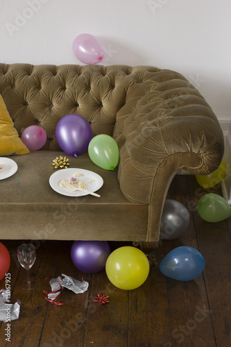 Photo: Balloons scattered around sofa Balloons scattered around sofa