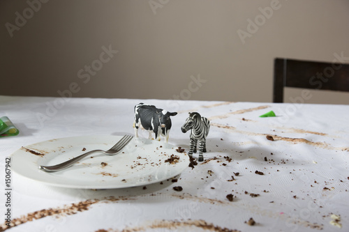 Photo: Animal figurines on messy table Animal figurines on messy table