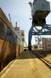 Limassol, Cyprus. Crane loading a freighter with cargo on quayside