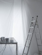 Photo: Desk with phones and cables covered in transparent dust sheets with step ladder Desk with phones and cables covered in transparent dust sheets with step ladder