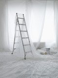 Photo: Empty room covered in transparent dust sheets prepared for painting and decorating Empty room covered in transparent dust sheets prepared for painting and decorating