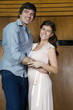 Young couple embracing and smiling