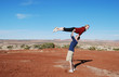 A couple performing a lift in the desert of Moab, UT.