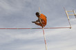 Pole vaulted in mid-air, low angle view
