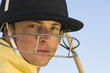 Polo player wearing helmet, close-up, portrait