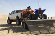 ATVs on Trailer Behind Pickup Truck