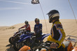three young men on atvs