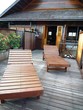 A veranda with deck chairs