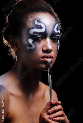 Photo: Portrait of mulatto girl with face-art, body-art Portrait of mulatto girl with face-art, body-art