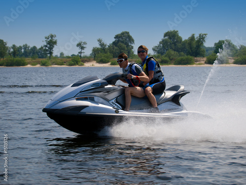 Photo: Couple men on jet ski in the river Couple men on jet ski in the river