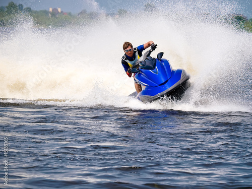 Photo: Man on Wave Runner on the water Man on Wave Runner on the water