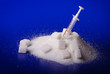 Insulin injection white a pile of sugar Insulin injection white a pile of sugar