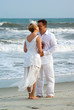 Bride and groom kissing at the oceanfront