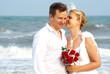 Young beautiful bride whispering to the groom and smiling