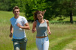 Young man and woman running outdoors Young man and woman running outdoors