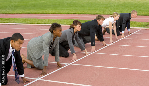 Photo: Business People Kneeling at the Starting Line Business People Kneeling at the Starting Line