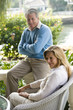 Photo: Mature couple relaxing on terrace Mature couple relaxing on terrace