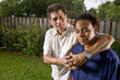 Teenage boy with proud father