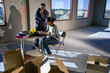 Multi-ethnic businesspeople preparing new office space