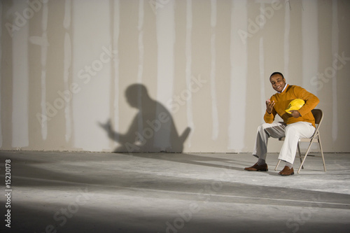 Photo: Man in office space ready for buildout Man in office space ready for buildout