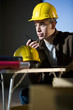 Photo: Construction worker talking on walkie-talkie Construction worker talking on walkie-talkie