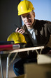 Construction worker holding walkie-talkie