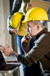 Close-up of construction worker on walkie talkie