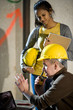 Close-up of male and female construction workers