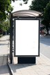 Black banner on a bus shelter.