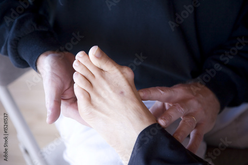 Photo: podiatrist examines a bunion podiatrist examines a bunion