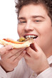 Foto: Happy chubby boy eating a slice of pizza, isolated on white Happy chubby boy eating a slice of pizza, isolated on white