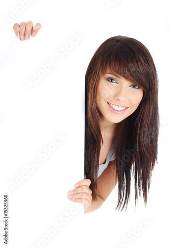 Photo: Sexy girl holding a blank billboard. Sexy girl holding a blank billboard.