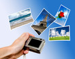Digital camera and photographs against blue background Digital camera and photographs against blue background