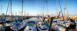 series of panoramic images from the harbor with yachts at dusk