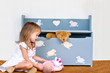 Child playing with her toys.