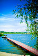 Beautiful lake scene of a wooden pier Beautiful lake scene of a wooden pier