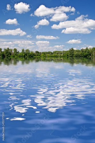 Photo: forest and the sky reflected in lake forest and the sky reflected in lake