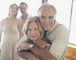 Mature couple with younger couple in background