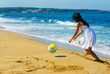Girl and a ball on the beach Girl and a ball on the beach