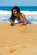 Happy girl laying on the beach Happy girl laying on the beach