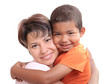 Little African boy  in adoptive mothers arms